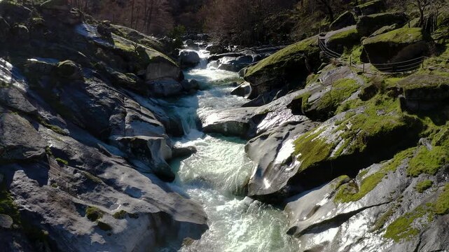 Aerial view of Los Pilones Bridge area in Garganta de los Infiernos, Spain. Exceptional river flow surging through granite formations in Jerte Valley, creating powerful whitewater and dramatic flood.