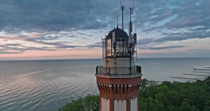 Beautiful lighthouse at sunset in Rewal at Baltic Sea.