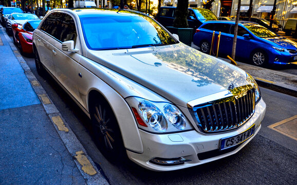 Paris, France - april 18th 2015 : White Mercedes Maybach 62s parked in George V avenue. Front view of this german limousine. It's parked in front of a big hotel.