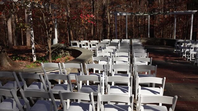 Outdoor wedding ceremony seating in autumn woodland