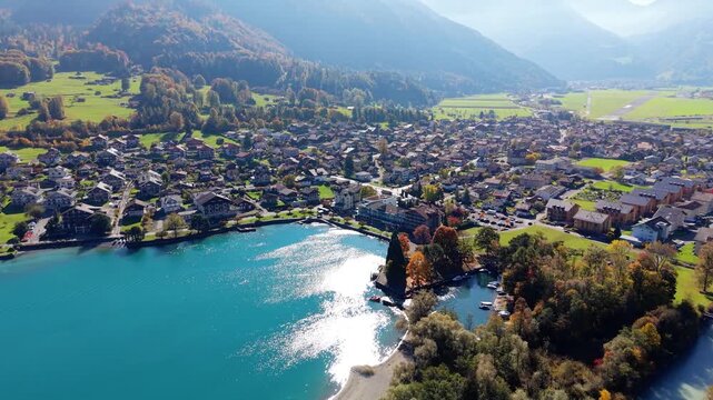 Interlaken Airport old site and Lake Brienz autumn street aerial view in Bonigen. Interlaken, Canton of Bern, Switzerland.