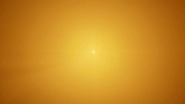 Radiant gradient of golden yellow hues with a subtle central luminosity
