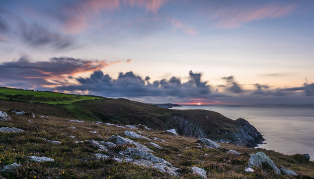 Beautiful long exposure capture of Pembrokeshire coast, Wales, UK at sunset.