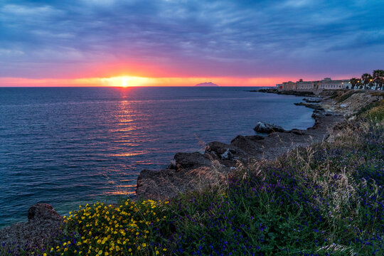 Sunset over Lungomare Boeo in Marsala with the Lilibeo Museum.
