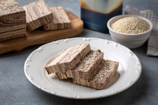 Halva dessert with sesame paste and cacao on white. Turkish name; helva