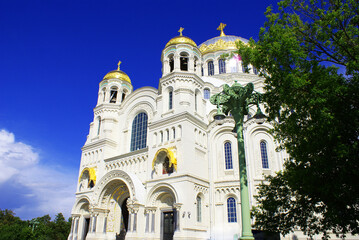Fototapeta premium Temple with golden baths, church, summer park. Architecture.