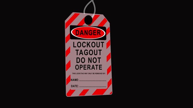 Lockout tagout safety sign hangs on industrial machinery belts to prevent operation and ensure worker protection in hazardous environments.