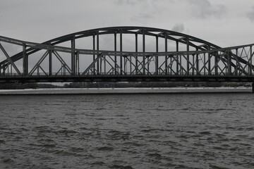Fototapeta premium Crossing a bridge on a foggy and cold afternoon