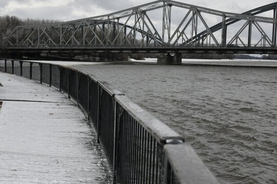 Crossing a bridge on a foggy and cold afternoon