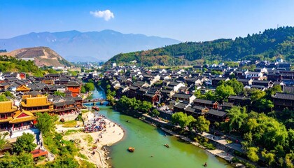 Obraz premium Aerial View of Ancient Town with River and Mountains.
