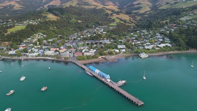 Akaroa town outside Christchurch drone aerial 4k