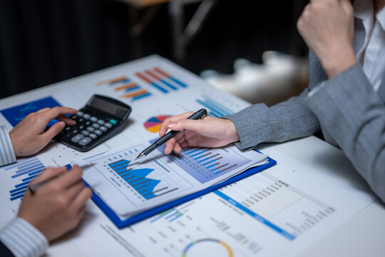 Business colleagues analyzing financial data and sales performance