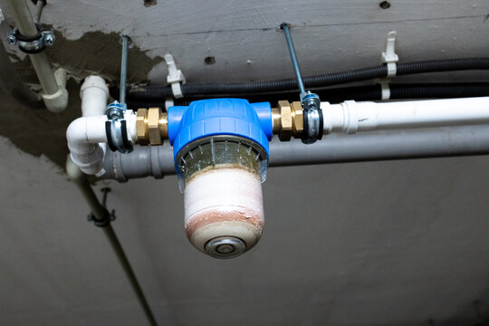 Inline sediment water filter installed in residential plumbing pipes