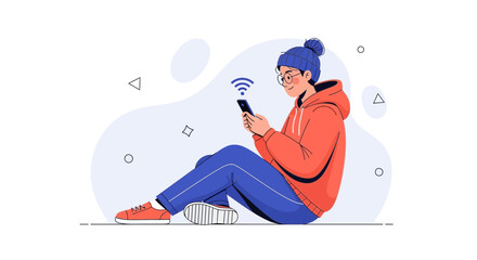 Obraz premium Young person with glasses and beanie using smartphone with wifi symbol, sitting on floor.