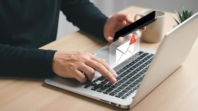 Phishing alert on laptop and smartphone shows digital identity warning with malware threat notification in email protecting against cyber attack and online fraud threat