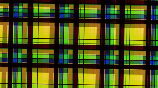 Abstract Geometric Pattern of Yellow, Green, and Blue Squares.