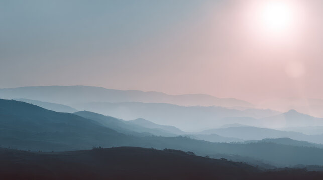 Misty mountain soft pastel sky sunrise light distant hill atmospheric depth serene landscape minimal nature scene with dreamy