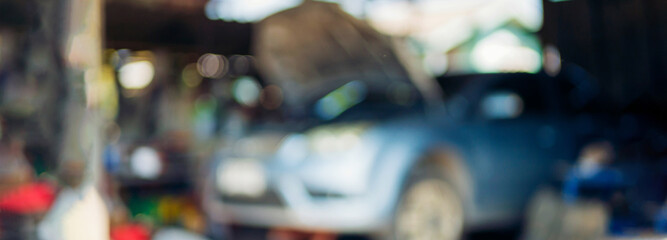 Blur background Mechanic tools engineering equipment car auto repair shop. Blurred background mechanical service. Defocused soft effect vehicle station industrial blurry car garage with copy space
