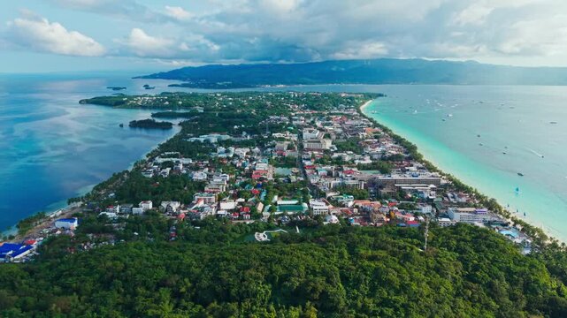 Drone flying backward over Boracay Island tropical coastline Philippines