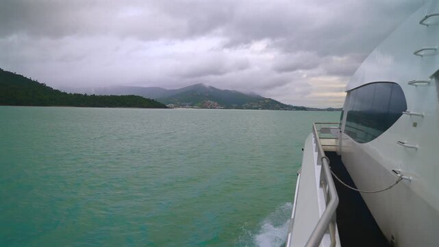 Hamilton Island Port of Airlie Coral Sea Marina boat ride cruise Great Barrier Reef Whitsunday islands Australia Queensland Heart of the Reef coastline cloudy rainy afternoon sunset forward motion