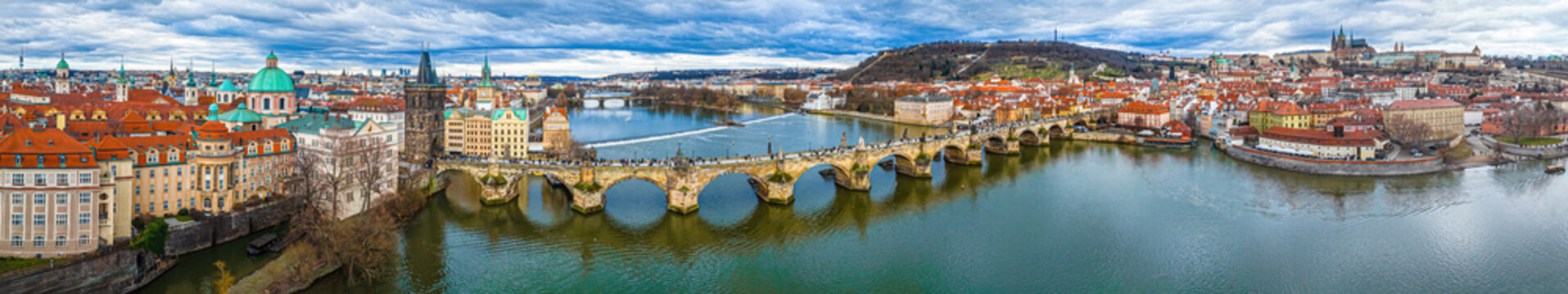 Charles Bridge Prague panorama over Vltava River and historic city skyline