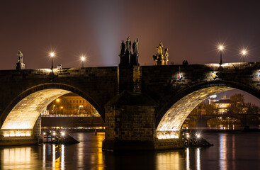 Fototapeta premium Charles Bridge statues at night with Prague Castle skyline, Czech Republic