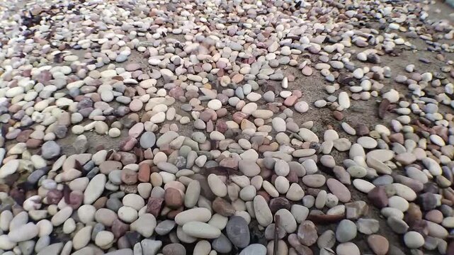 Close-up view of small colorful pebbles scattered across the ground
