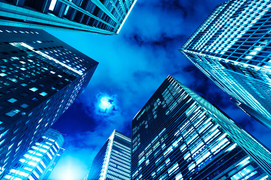 Futuristic urban architecture and high-rise office buildings under a dramatic night sky.