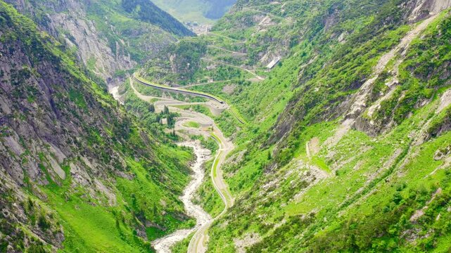 Switzerland. Picturesque winding mountain road with tunnels Gotthardstrasse. Drone footage