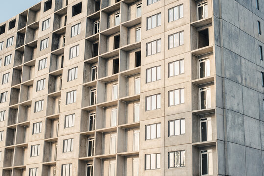 facade of a building. New building. House under construction. Construction site.