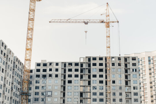 building under construction. New building. House under construction. Construction site. House under construction and a crane.