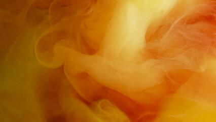 Fototapeta premium Orange paint cloud. Ink vapor. Yellow warm color bright water smoke splash haze texture vibrant mist spill on abstract blur background.