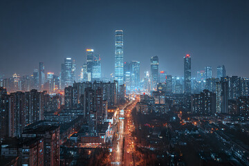 Obraz premium Downtown skyline at night with glowing skyscraper lights and busy city street illuminated by streetlights creating vibrant urban atmosphere full of energy and life