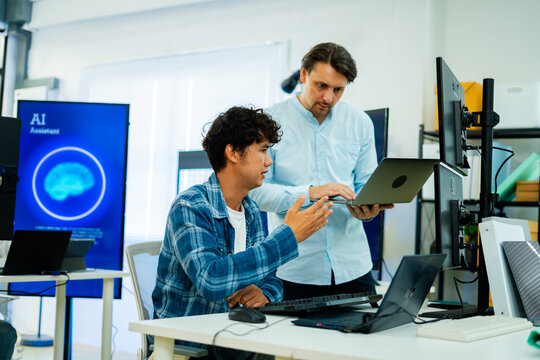 software engineer or programmer team working late in development office,problem solving or algorithm of ai assistant,ai agent helping for work.software developer,digital technology security concept