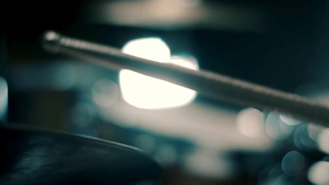 Close up view of young man playing drums with drumsticks while rehearsing in music studio Man with drum kit playing music practicing in a music studio