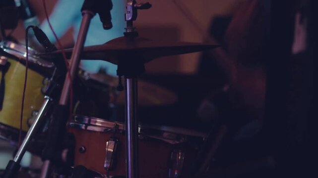 drummer rehearsing drums before a rock concert entertainment hitting snare drum Drummer Live And Strobe Lights Close up Asian enjoying performance