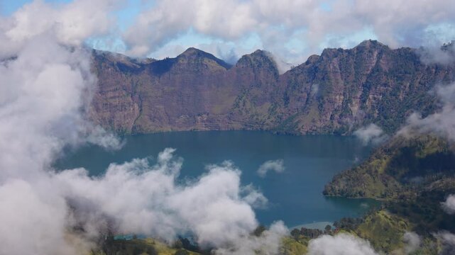Dramatic clouds over Sagara Anak lake inside the Rinjani caldera landscape, Indonesia