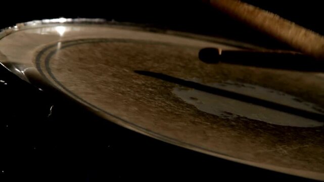 Close-up of drum equipment showing various components such as drumsticks Creates music and art sound Beats drumsticks on different cymbals The drummer