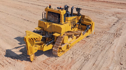 View of a huge D10-type bulldozer in the process of pushing clayey silty material onto platforms and embankments © WILL PHOTOGRAPHY