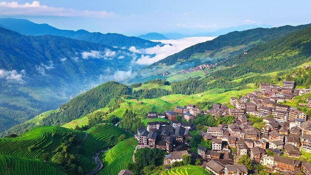 Aerial view of the spectacular Longji Rice Terraces and ethnic village landscape in Guilin, China.