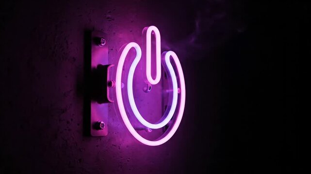Neon power button symbol illuminating a dark background