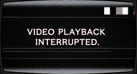 Old tv screen with static shows ' playback interrupted' message.