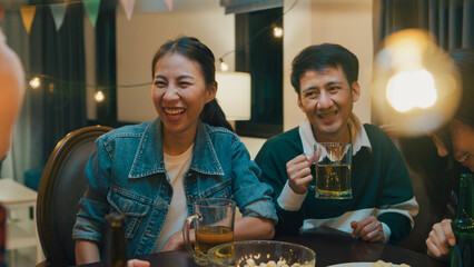 Group of multiethnic adult Asia friend drink alcohol beer bottle glass and fun talk laugh enjoy...