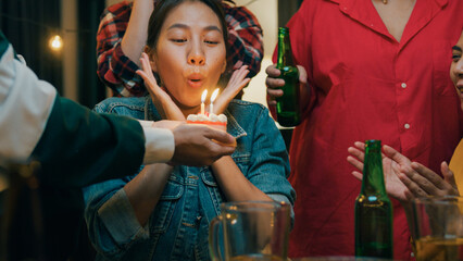 Group of young adult Asia friend surprised with birthday cake and drinking alcohol beer and fun...