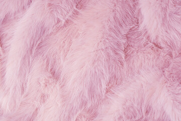Obraz premium Soft fluffy light pink fabric texture background with abstract luxurious wavy plush material