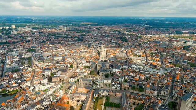 Ghent, Belgium. Cathedral of Saint Bavo. Panorama of the central city from the air. Cloudy weather, summer day. Drone footage, Point of interest