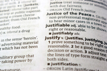 English Dictionary Page Close Up With The Word Definition Of - justifiable