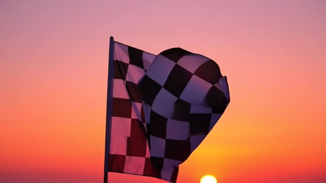 Checkered Racing Flag Waving at Sunset