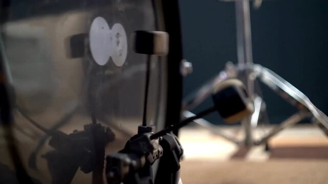 Man playing base drum pedal on stage Close-up, Drummer playing drum set beater strikes rhythmically against red bass kick drum. music concept background