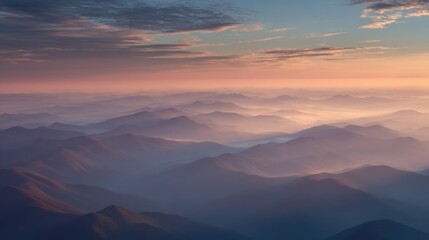 Obraz premium Serene Landscape of Mountains with Soft Hues at Sunrise, Capturing the Beauty of Nature and Tranquility in the Morning Sky